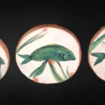 Handmade and decorative ceramic fish art tiles.
