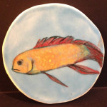 Blue fish decorative item in white earthenware.