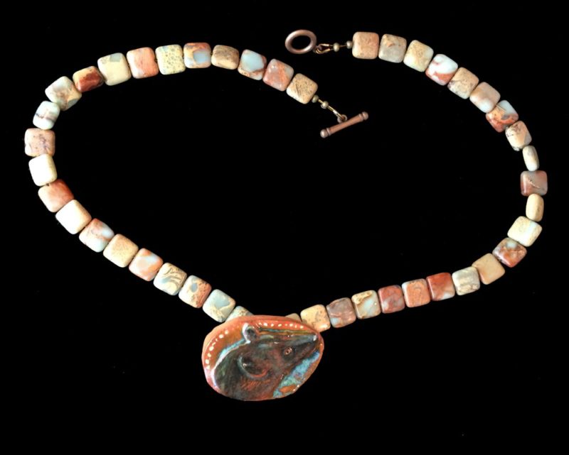 Hyena ceramic necklace.