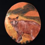 Yellow oval cat plaque.